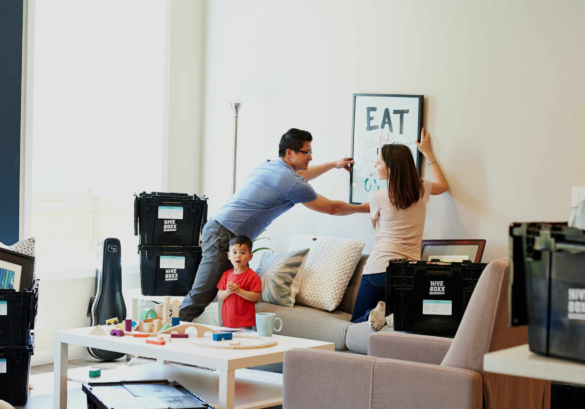 A renting couple and their young child move into a new rental property.