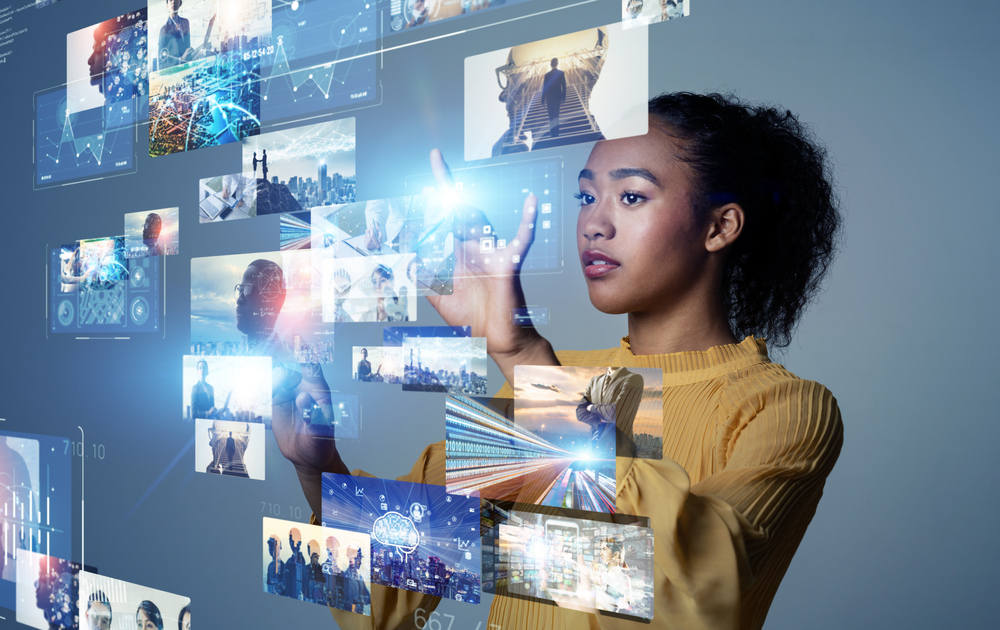 a woman organising her digital assets in a holographic image